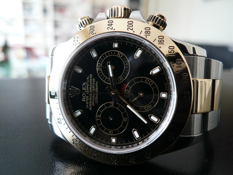 ROLEX DAYTONA OR ET ACIER
 	 
