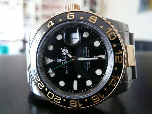 ROLEX GMT MASTER II OR ET ACIER LUNETTE CERAMIQUE